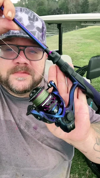 Angler holding a KastKing reel